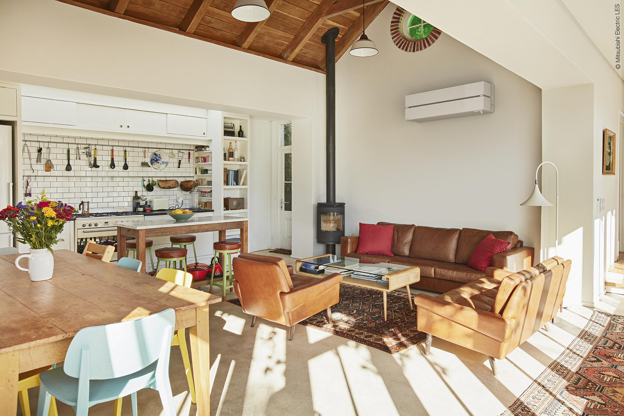 Furniture arranged in living room with painting on wall at home